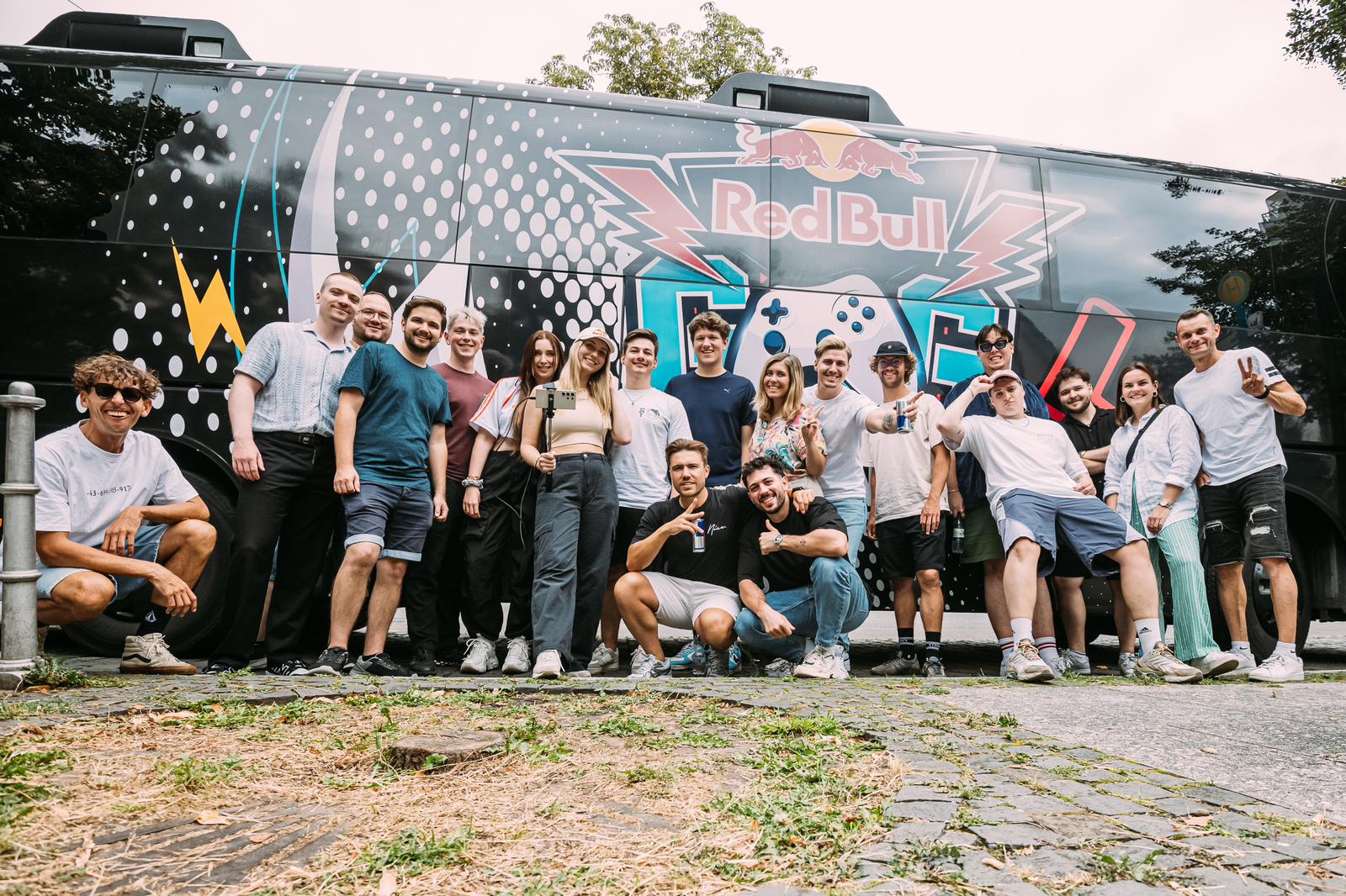 The crew posing in front of the Red Bull gaming bus on the road trip to Gamescom